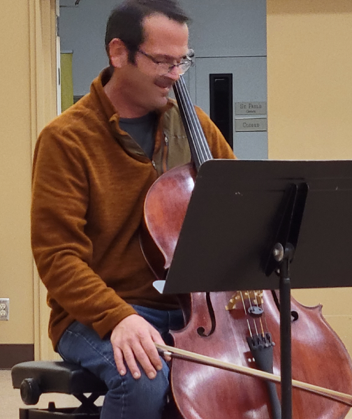 A man playing the cello